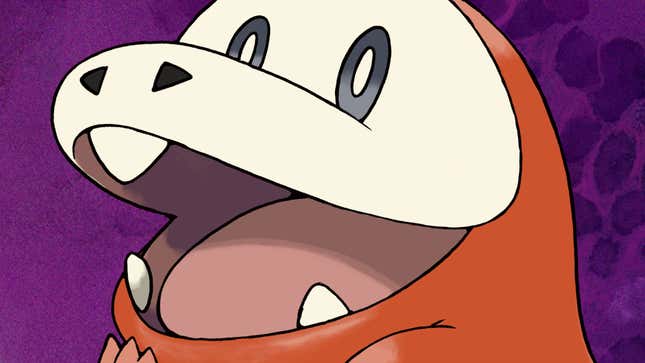 A weird, orange lizard creature is smiling at the viewer.